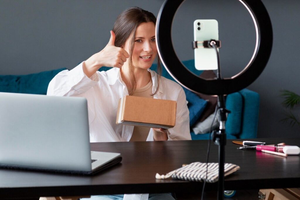 young woman making unboxing vlog 23 2149039694